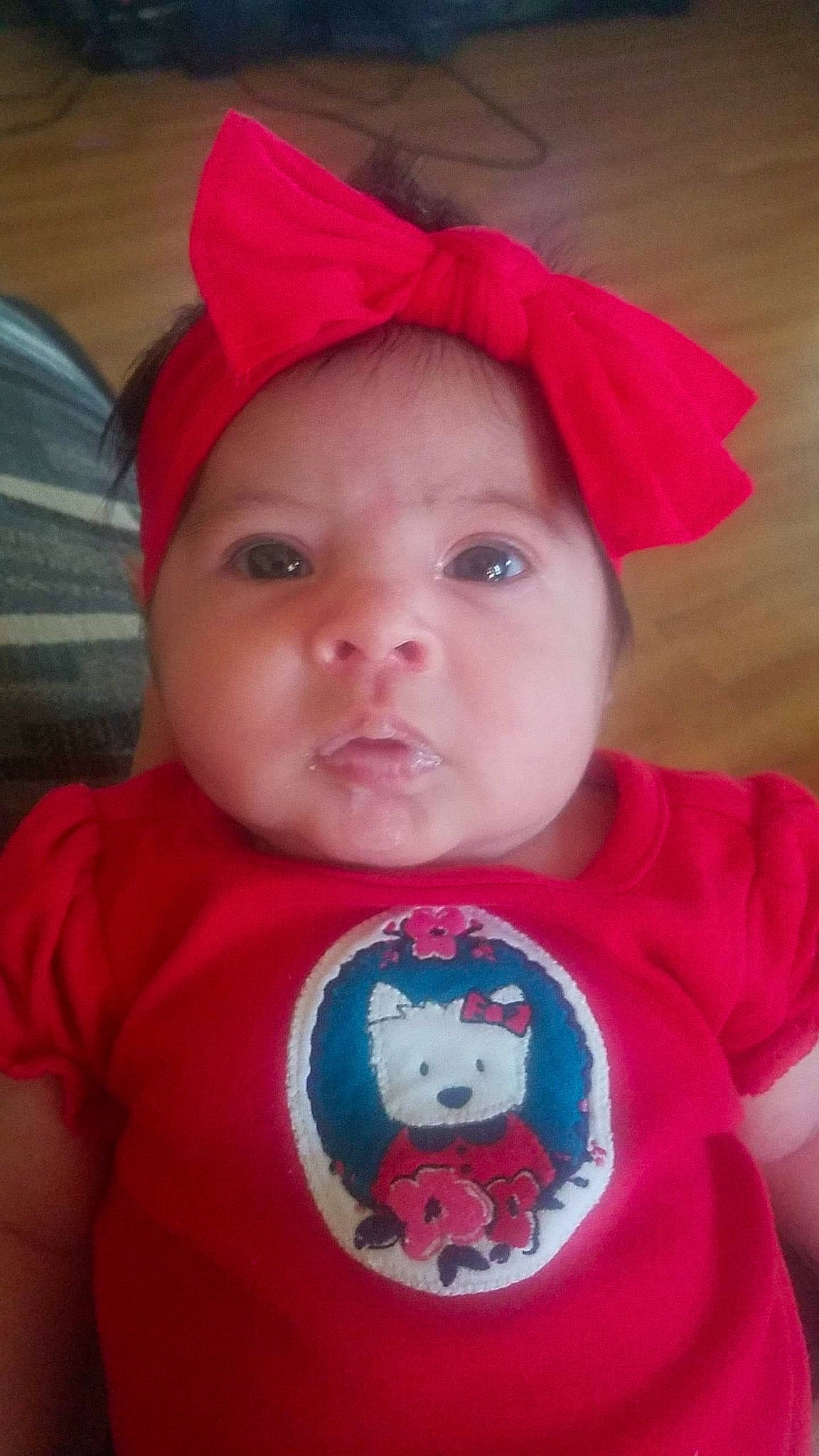Shyla is registered to the contest to win money with this photo: baby, baby_products, baby_toddler_clothing, carmine, cheek, child, chin, cool, costume_accessory, costume_hat, fictional_character, headgear, headwear, iris, lip, mouth, person, pink, red, skin