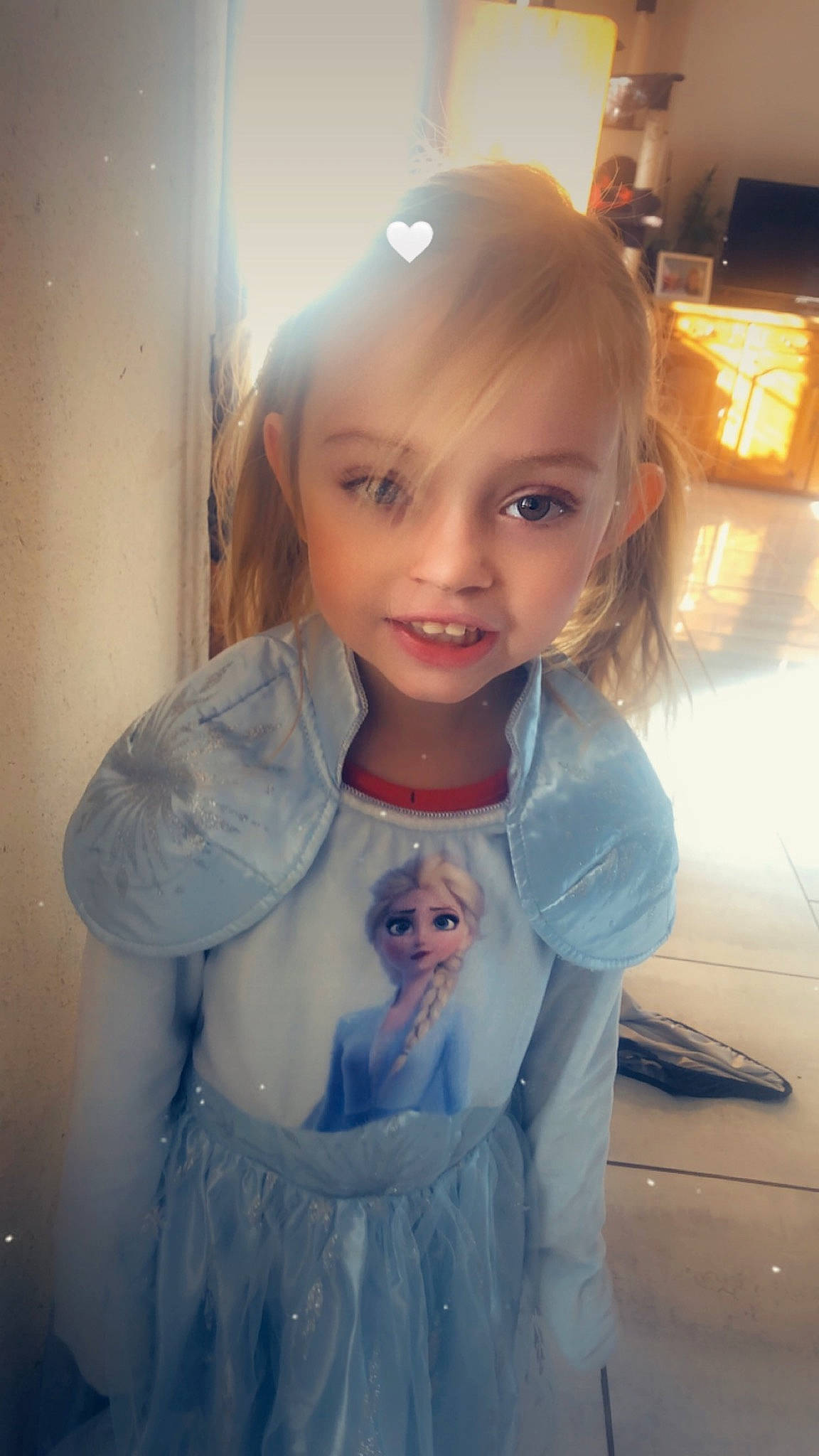 Eloïse participe au concours pour gagner de l'argent avec cette photo : baby_toddler_clothing, blond, brown_hair, dress, eyelash, facial_expression, formal_wear, fun, happy, head, iris, lip, long_hair, mouth, person, shoulder, skin, sleeve, smile, standing