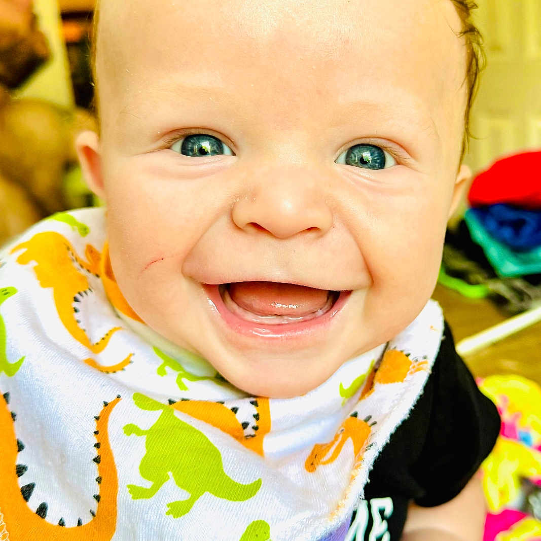 Alexandar joined the competition — help win amazing prizes! baby, babylaughing, bib, blonde, bodypart, clothing, face, finger, hair, hand, happy, head, laughing, mouth, person, photography, portrait, scarf, smile, teeth