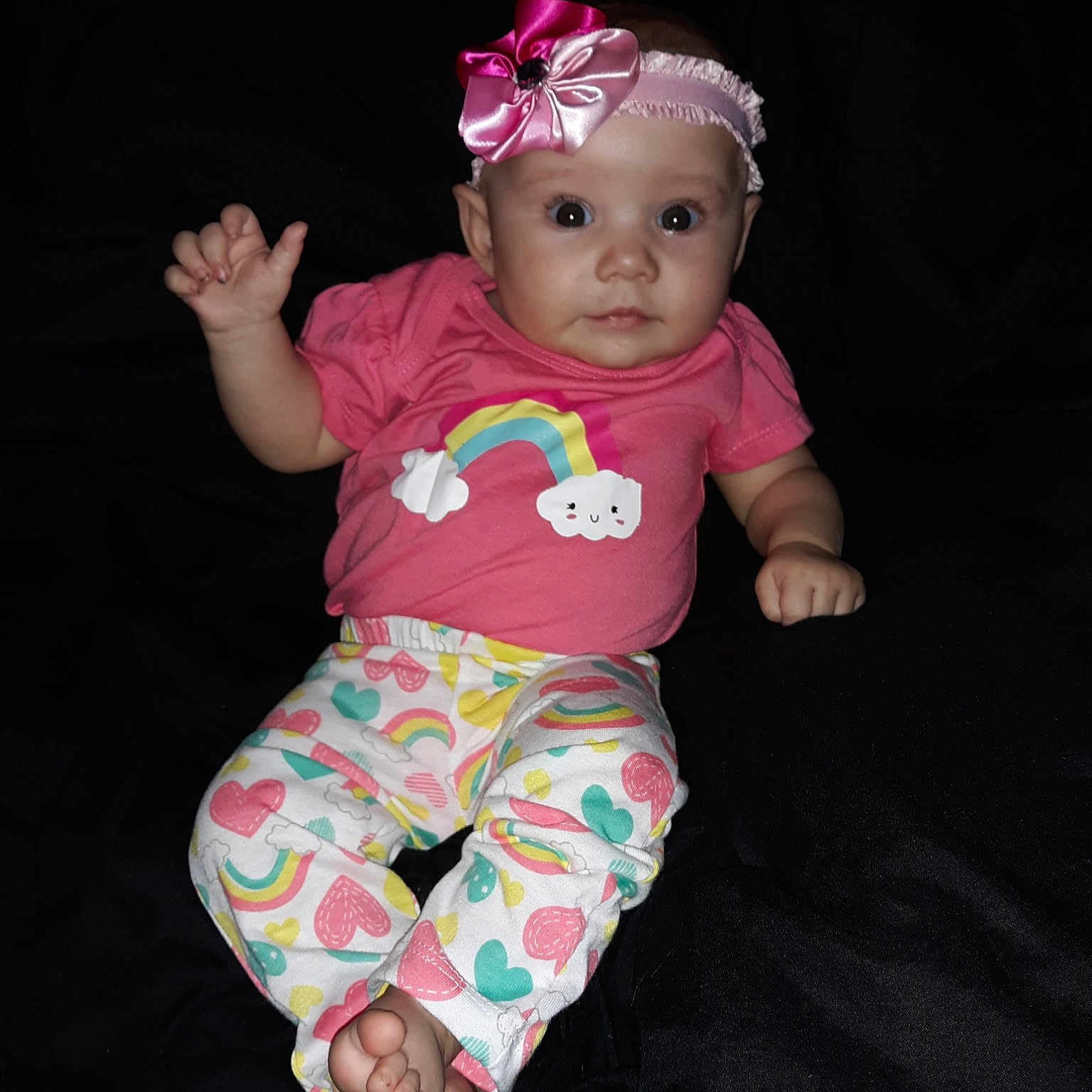 Karly is registered to the contest to win money with this photo: baby, baby_products, baby_toddler_clothing, child, fun, hair_accessory, headgear, person, photography, pink, sitting, skin, smile, toddler