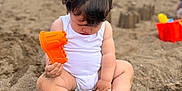Jacobie joined the competition — help win amazing prizes! baby, background, beach, child, clouds, cute, fun, legs, orange, outdoor, people, play, sand, sandcastle, sitting, sky, summer, toes, toy, white_clothing