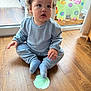 Jacobie is registered to the contest to win money with this photo: baby, blue_clothing, child, cozy, curious, curly_hair, cute, dinosaur_toy, eleven_months, floor, indoor, milestone_card, natural_light, pajamas, plush_toy, portrait, sitting, sock, window, wooden_floor