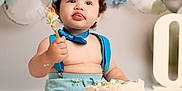 Jacobie joined the competition — help win amazing prizes! baby, cake, birthday, party_hat, blue_suspender, messy, cake_smash, balloons, celebration, one_year_old, child, sitting, food, smile, fun, colorful, cute, indoor, festive, portrait