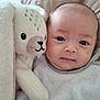 Hae-In a rejoint le concours — aidez-le/la à gagner de superbes lots ! baby, infant, child, stuffed_animal, plush_bunny, bunny, toy, face, eyes, cheeks, blanket, bed, pillow, bib, clothing, portrait, close_up, cozy, indoor, soft_texture