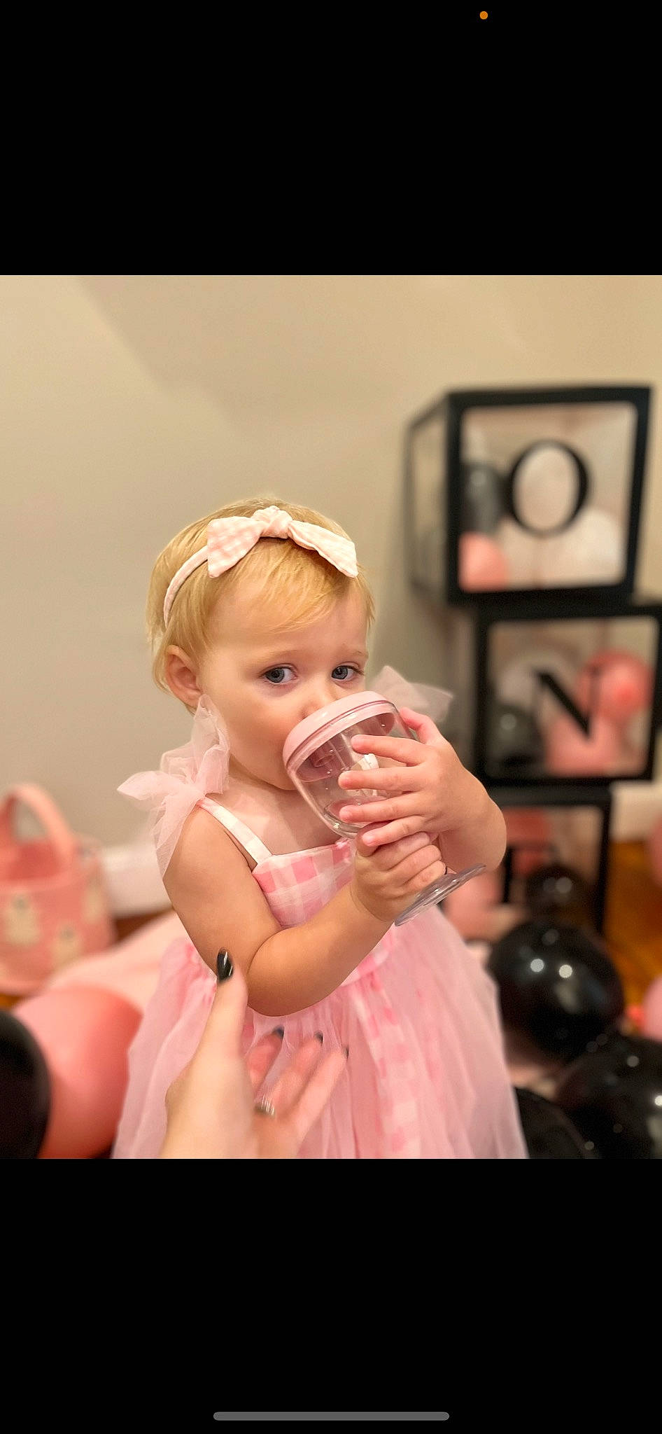Saylor is registered to the contest to win money with this photo: arm, baby, ball, blond, bridal_clothing, child, dress, event, eyelash, flash_photography, fun, gesture, happy, jewellery, lip, peach, person, pink, room, shoulder