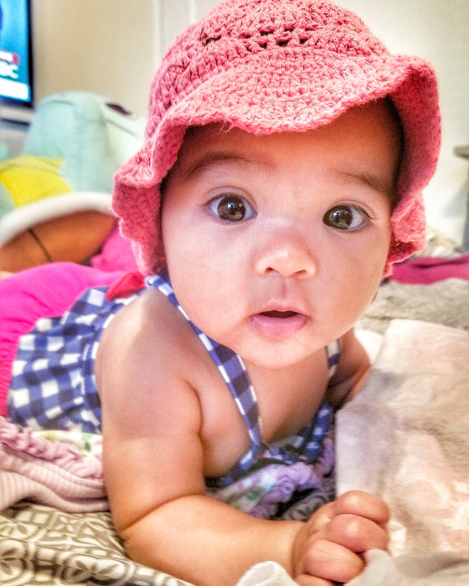 Luna Blair is registered to the contest to win money with this photo: beanie, bonnet, cap, cheek, child, crochet, girl, hair_accessory, hat, headgear, headwear, infant, knit_cap, knitting, lip, person, pink, skin, smile, toddler