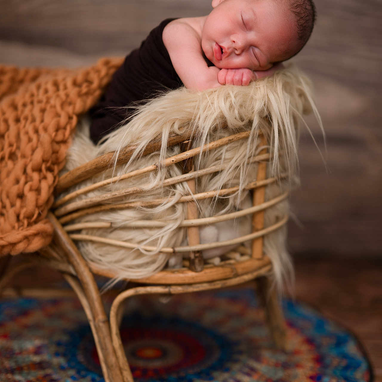 Axyl is registered to the contest to win money with this photo: baby, blanket, child, colorful_rug, cozy, cute, decor, fluffy_cushion, indoor, infant, newborn, peaceful, portrait, resting, sleeping, soft_lighting, texture, warm_colors, wicker_chair, wooden_floor