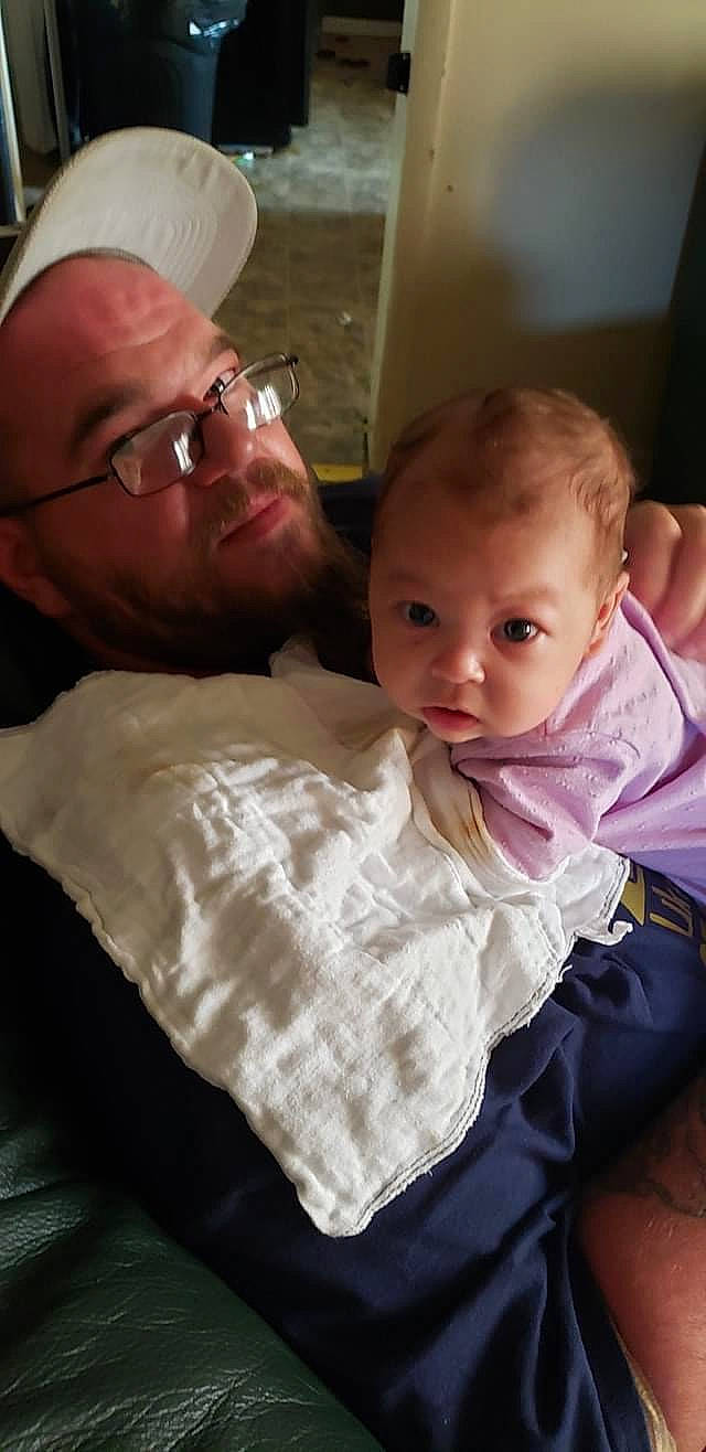 Jalani is registered to the contest to win money with this photo: baby, baby_toddler_clothing, cap, cheek, chin, comfort, couch, face, facial_expression, fun, glasses, hairstyle, happy, head, iris, lap, mouth, nose, person, skin