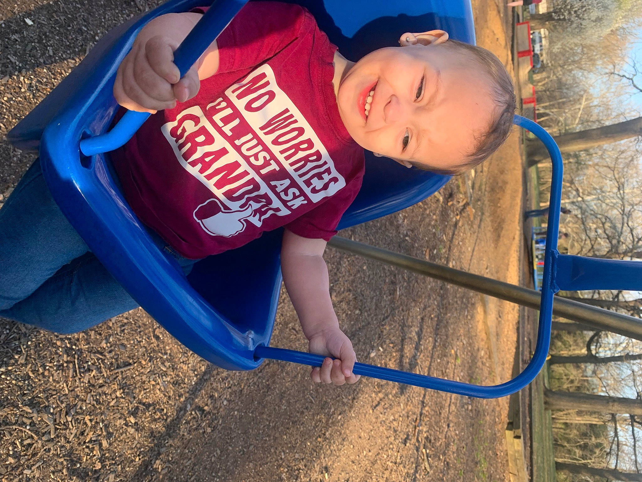 Jalani is registered to the contest to win money with this photo: blue, child, city, electric_blue, fun, grass, happy, joy, leisure, outdoor_play_equipment, people_in_nature, person, photograph, playground, recreation, sky, smile, soil, t_shirt, toddler