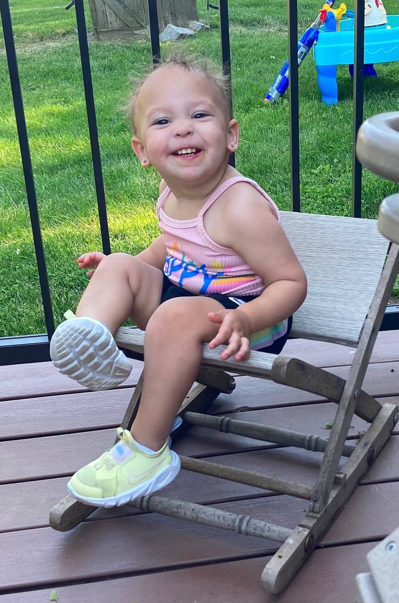 Jalani joined the competition — help win amazing prizes! baby_toddler_clothing, barefoot, child, electric_blue, fun, grass, happy, human_leg, joint, joy, knee, leisure, person, recreation, shorts, sitting, smile, sock, summer, swing