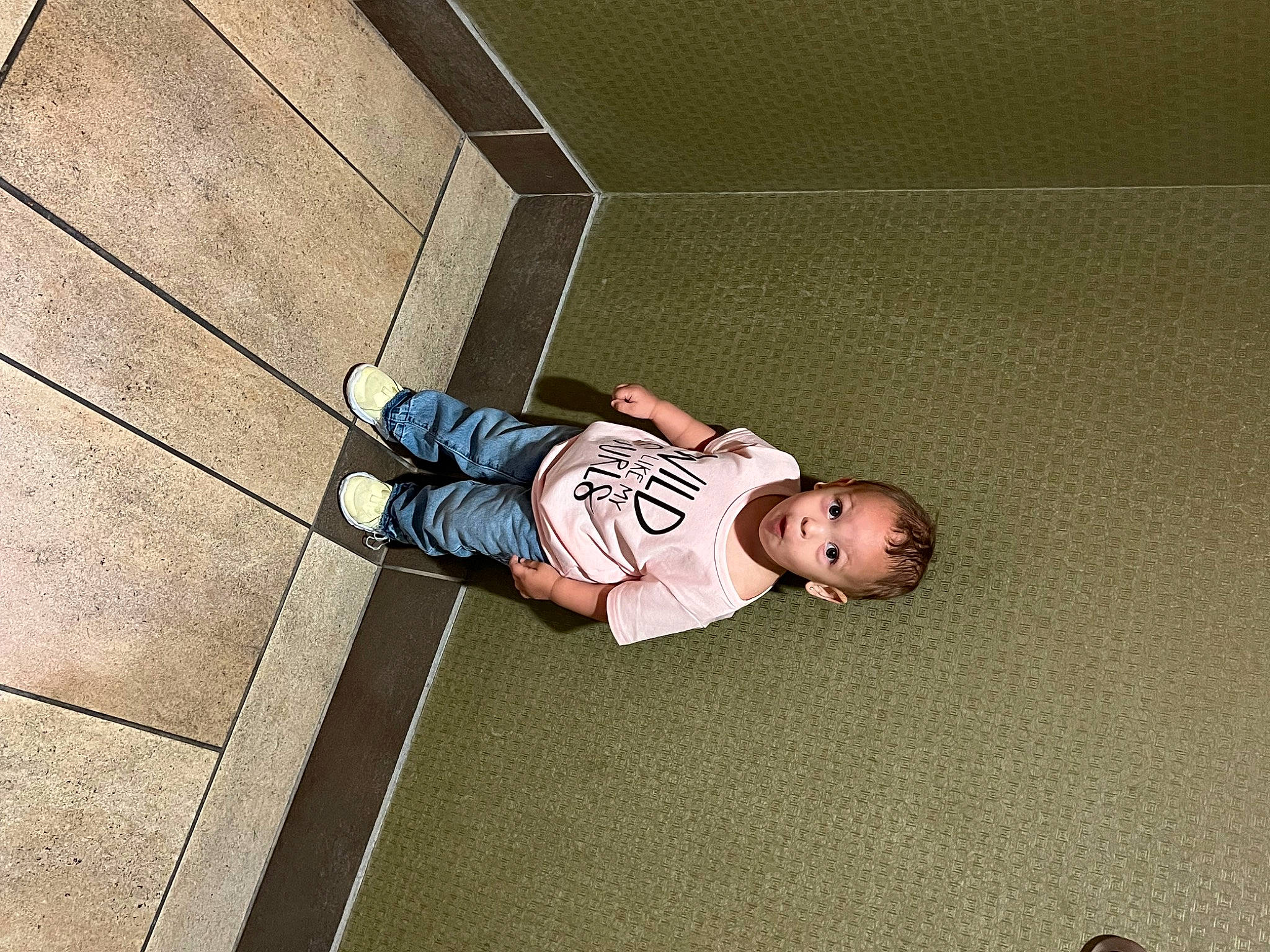 Jalani joined the competition — help win amazing prizes! baby, baby_toddler_clothing, child, concrete, floor, flooring, grass, hardwood, human_leg, leisure, pattern, person, play, rectangle, road_surface, shadow, sidewalk, sitting, surprise, tints_and_shades