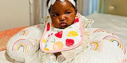 Gabriella is registered to the contest to win money with this photo: baby, bed, bonnet, clothing, cushion, face, furniture, happy, hat, head, homedecor, indoors, medication, person, photography, pill, pillow, portrait, sitting, smile