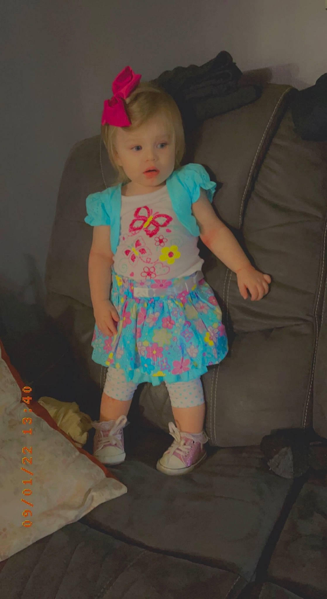 Kelahni is registered to the contest to win money with this photo: baby, baby_toddler_clothing, child, couch, day_dress, fun, human_leg, magenta, pattern, person, pink, room, sandal, sleeve, sock, standing, t_shirt, textile, thigh, toddler