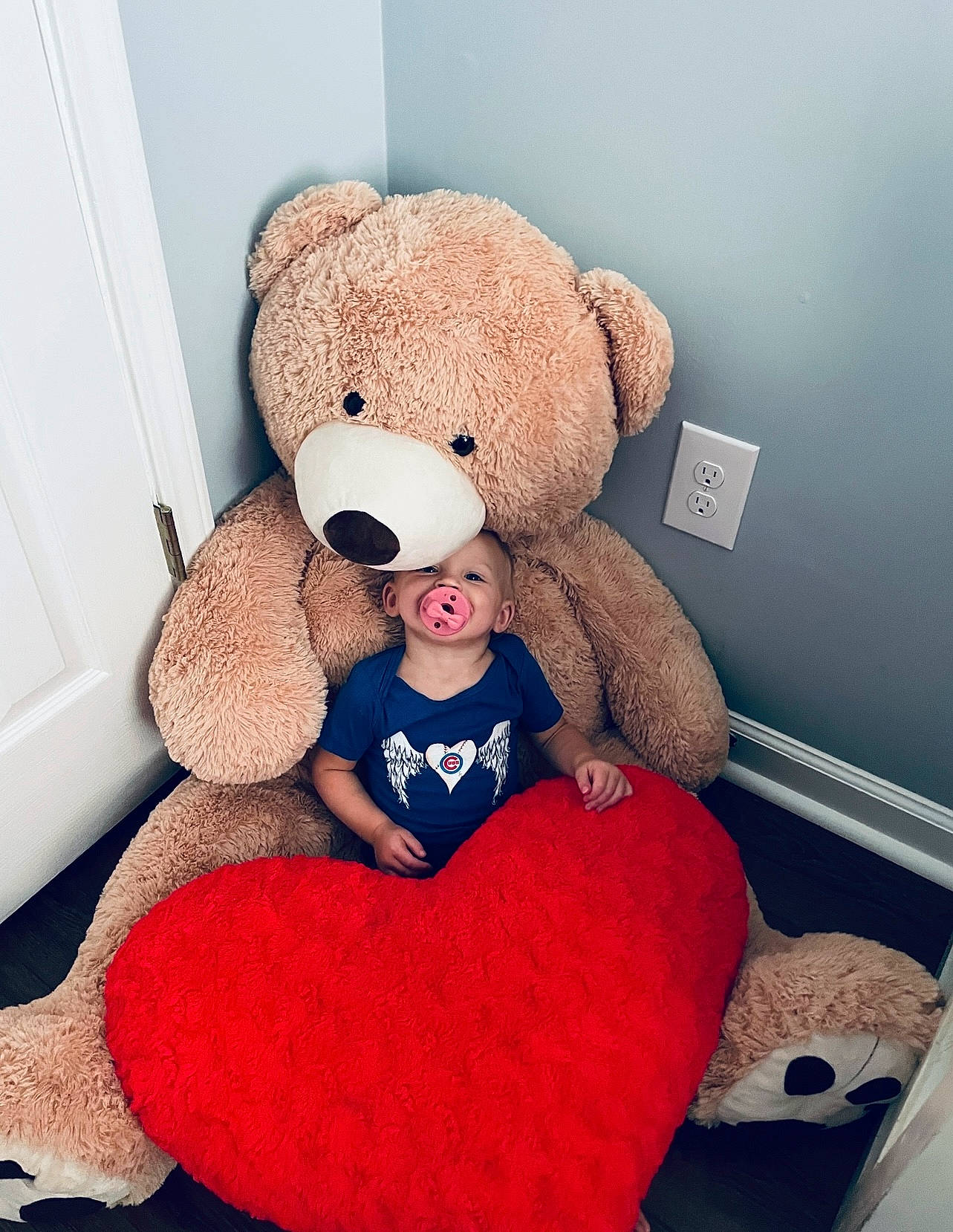 Raelynn is registered to the contest to win money with this photo: baby_toys, bear, carmine, comfort, couch, doll, fur, head, magenta, person, pink, plush, product, red, room, sitting, stuffed_toy, teddy_bear, textile, toy
