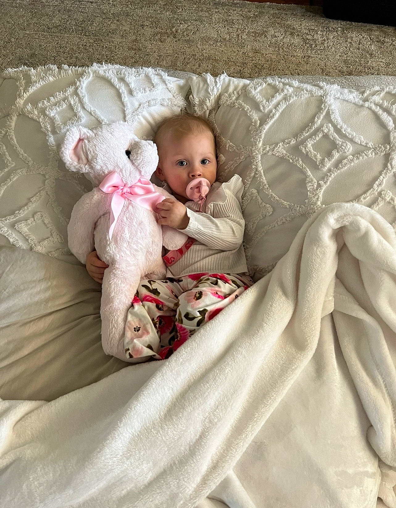 Raelynn is registered to the contest to win money with this photo: baby, baby_products, baby_sleeping, baby_toddler_clothing, bed, bed_sheet, bedding, bedtime, child, comfort, couch, eye, fur, head, linens, person, sitting, sleeve, teddy_bear, throw_pillow