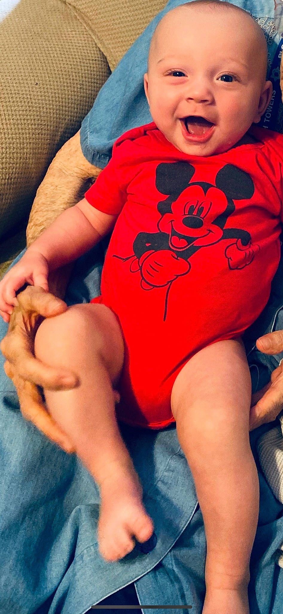 Ethan is registered to the contest to win money with this photo: arm, baby_toddler_clothing, blue, comfort, eye, hairstyle, happy, head, human, joint, leg, mouth, muscle, neck, orange, organ, person, skin, sleeve, stomach