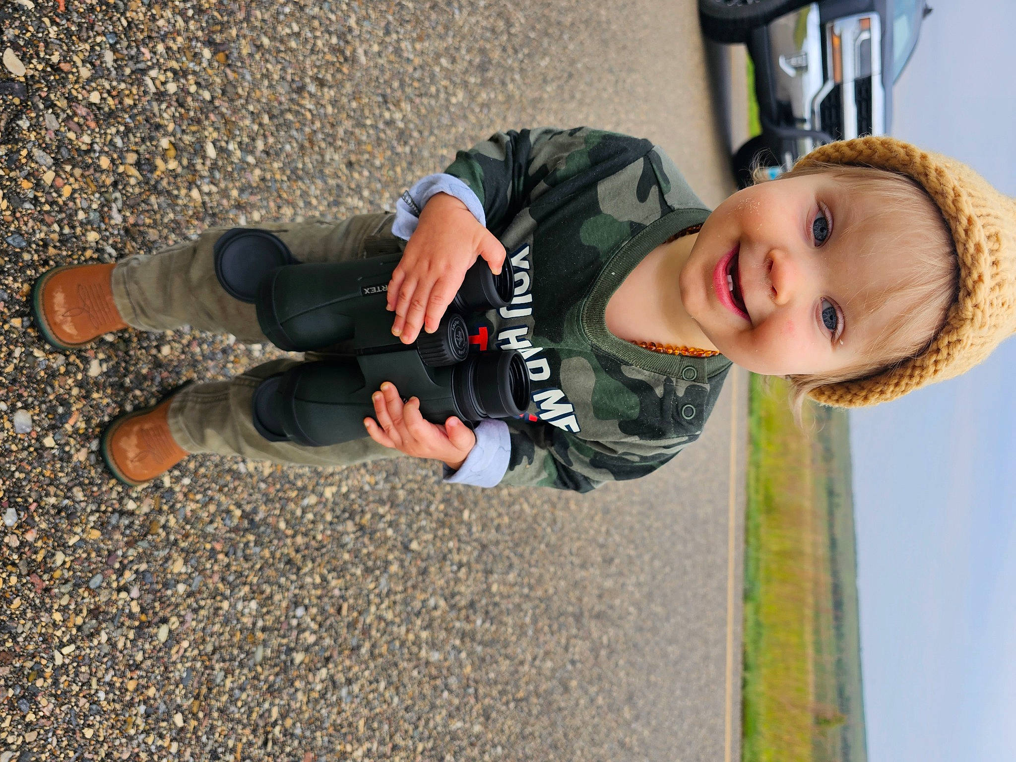 Alina joined the competition — help win amazing prizes! asphalt, baby, baby_toddler_clothing, child, fun, gesture, grass, happy, human_leg, joy, leisure, people_in_nature, person, road_surface, shadow, sky, smile, sneakers, soil, toddler