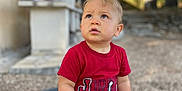 Milann participe au concours pour gagner de l'argent avec cette photo : toddler, child, red_clothing, jordan_logo, outdoor, daylight, trees, gravel_ground, gray_tub, curious_expression, standing, shorts, short_sleeves, blond_hair, face, person, nature, sunlight, blurred_background, young_child