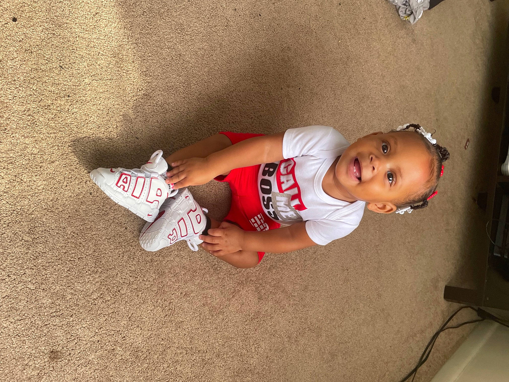 Nevaeh is registered to the contest to win money with this photo: abdomen, baby, baby_toddler_clothing, carmine, chest, child, elbow, floor, flooring, foot, fun, human_leg, joy, knee, leg, person, smile, sock, thigh, toddler
