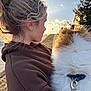 Dashey joined the competition — help win amazing prizes! brown_hoodie, casual_clothing, clouds, collar, companionship, dog, fluffy_dog, grass, leash, nature, outdoor, path, person, pet, side_profile, sky, sunset, tree, warm_light, young_person