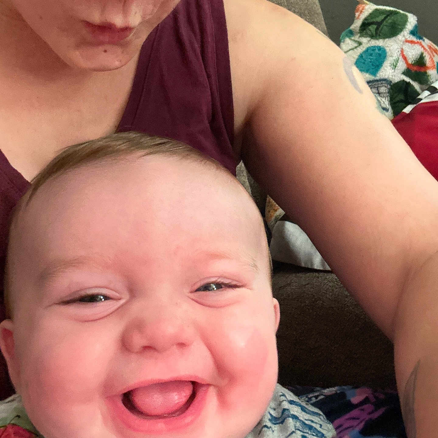 Raelynn joined the competition — help win amazing prizes! adult, arm, baby, cheerful, closeup, clothing, couch, expression, fabric, face, happy, human, indoor, infant, joy, parent, person, skin, smile, tattoo