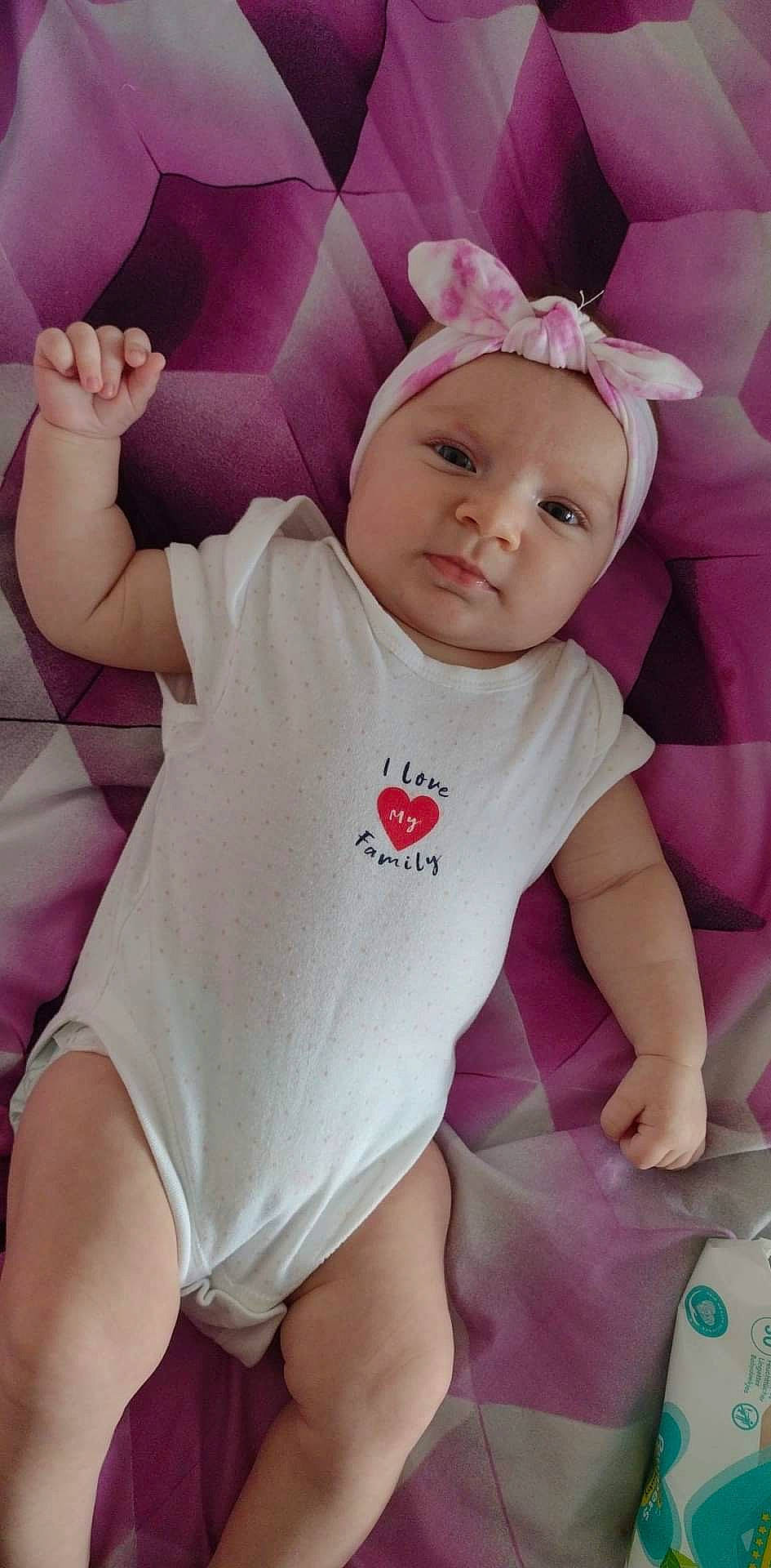 Adela Ioana joined the competition — help win amazing prizes! baby, baby_toddler_clothing, cheek, comfort, finger, gesture, hand, happy, head, headwear, human_body, magenta, mouth, neck, person, pink, purple, skin, sleeve, t_shirt