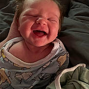 Lola Grace joined the competition — help win amazing prizes! baby, infant, smiling, laughing, pajamas, blanket, cozy, indoors, cute, child, face, happy, newborn, person, sleepwear, soft_light, portrait, hand, comfort, warm