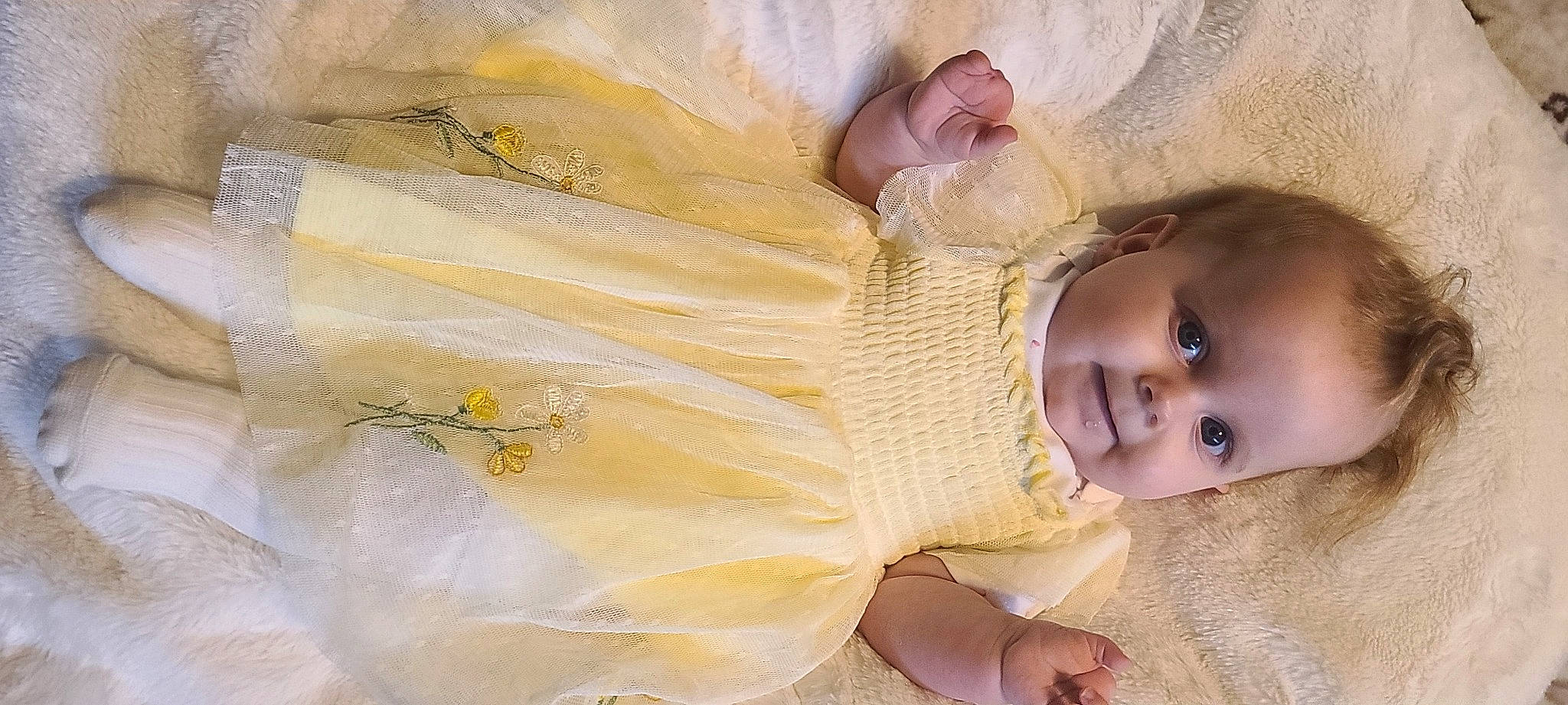 Amariah joined the competition — help win amazing prizes! baby, baby_toddler_clothing, cheek, dress, embellishment, eye, eyelash, grass, happy, iris, linens, lip, nose, pattern, person, skin, sleeve, smile, textile, toddler