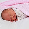 Romy a rejoint le concours — aidez-le/la à gagner de superbes lots ! newborn, baby, sleeping, blanket, pink, bed, white, infant, peaceful, cozy, soft, portrait, child, cute, rest, indoors, clothing, hand, face, sleep