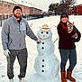 Auggie is registered to the contest to win money with this photo: beard, boots, building, cold, dog, fence, gloves, happy, hat, jacket, leash, outdoor, person, pet, smile, snow, snowman, snowy_ground, tree, winter