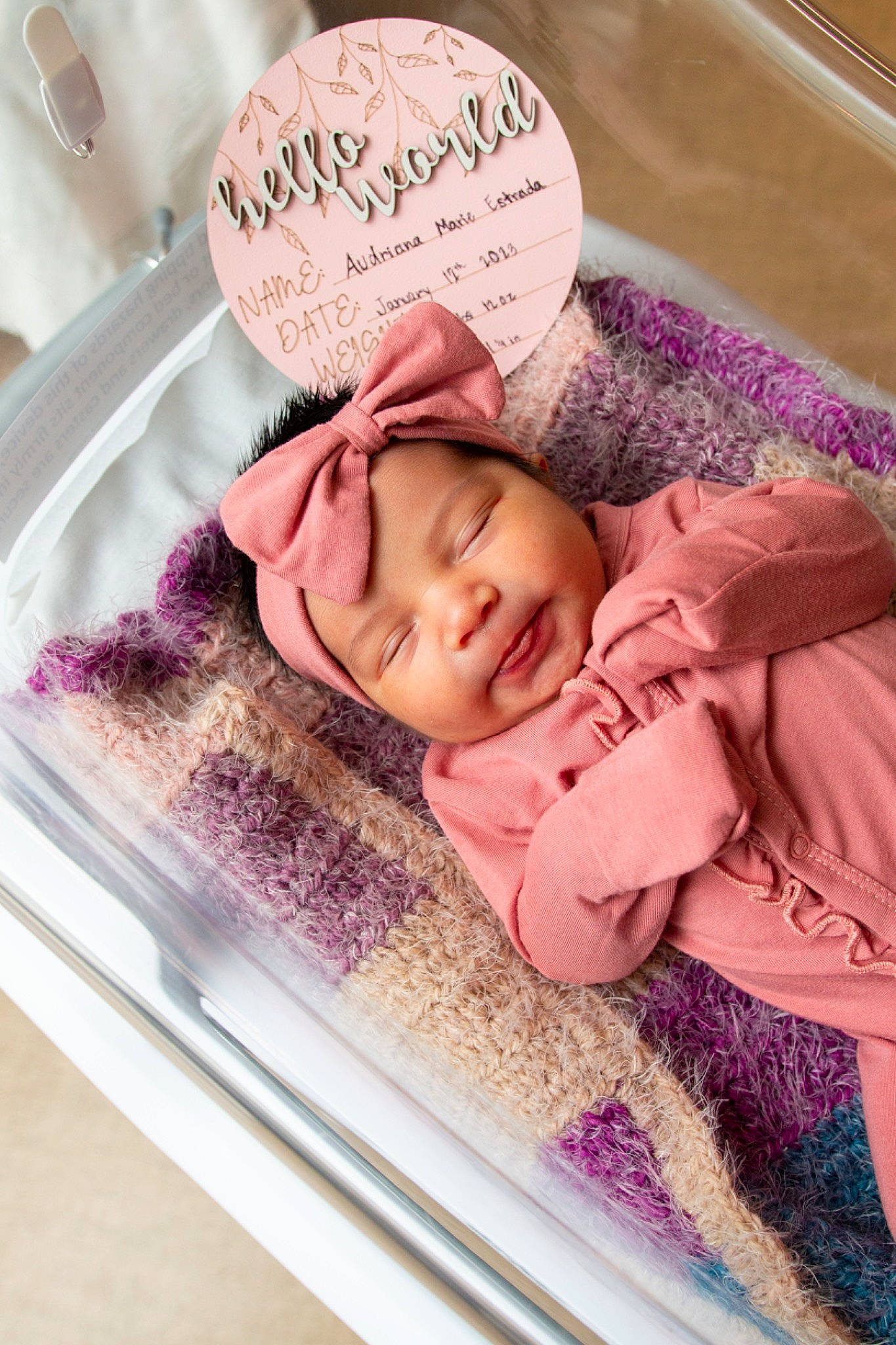 Audriana joined the competition — help win amazing prizes! baby, baby_products, baby_safety, baby_sleeping, baby_toddler_clothing, bedding, cheek, child, comfort, font, happy, headwear, infant_bed, linens, magenta, pattern, person, pink, purple, smile