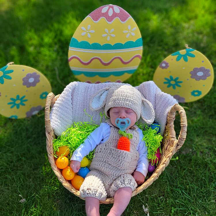 Carson joined the competition — help win amazing prizes! baby, balloon, basket, cap, clothing, easteregg, egg, face, food, grass, hat, head, nature, outdoors, people, person, photography, plant, portrait, sitting