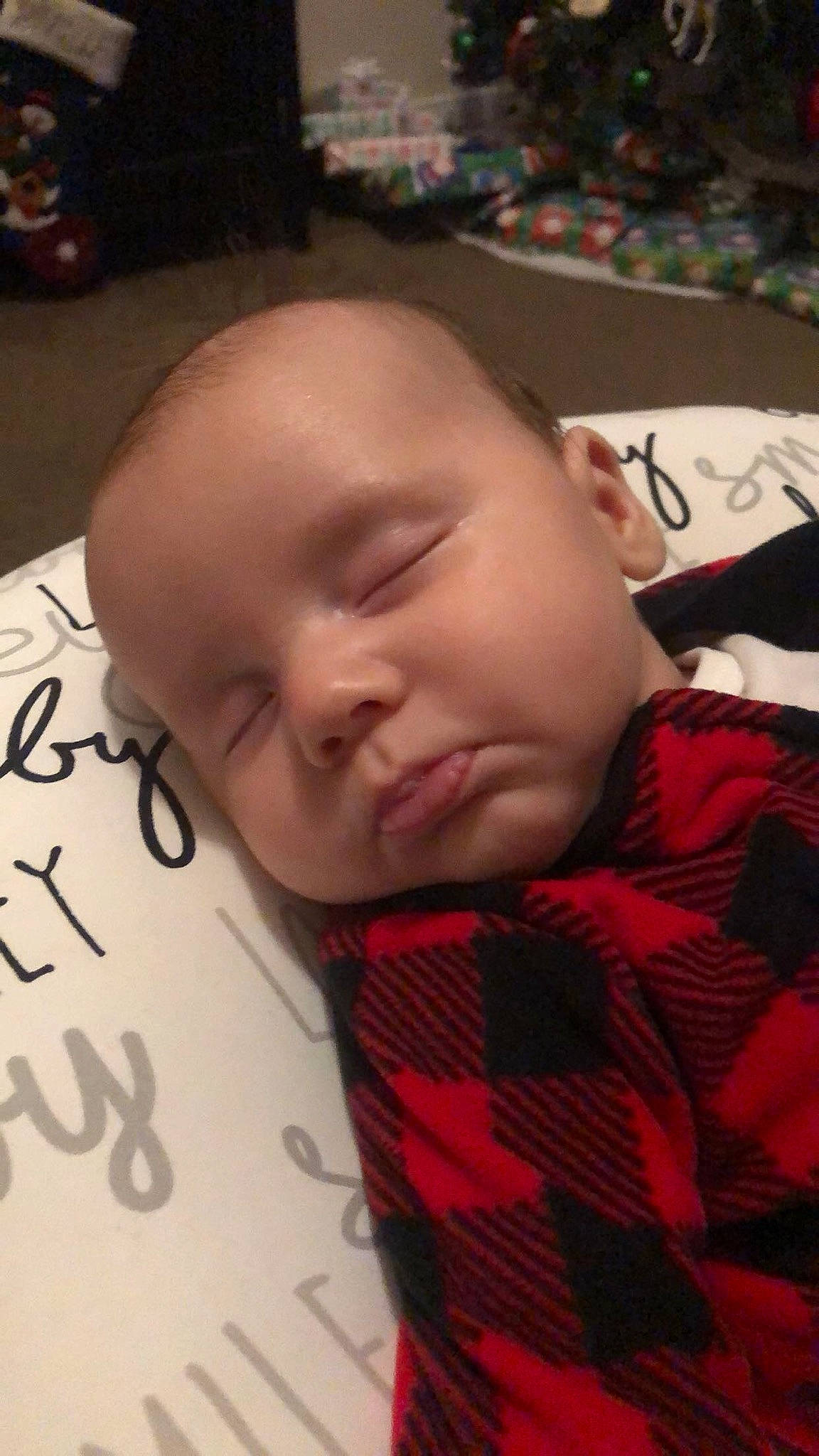 Brett is registered to the contest to win money with this photo: baby, cheek, child, design, ear, face, forehead, head, mouth, nap, nose, pattern, person, sleep, textile, toddler