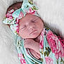 baby, blanket, child, closeup, cozy, cute, fabric, floral_pattern, flower, headband, infant, newborn, peaceful, portrait, resting, skin, sleeping, soft, white_background, wrapped