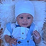 Legend is registered to the contest to win money with this photo: accessories, baby, bodypart, bonnet, cap, clothing, coat, costume, face, finger, furniture, hand, hat, head, jacket, newborn, pants, person, photography, portrait