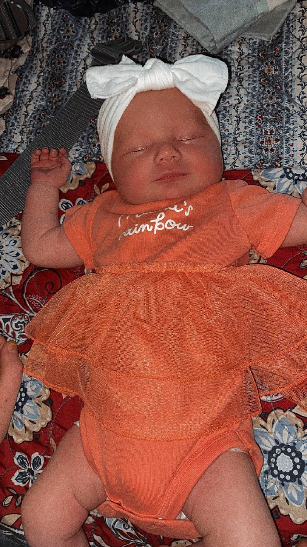 Jadelynn is registered to the contest to win money with this photo: abdomen, baby, baby_toddler_clothing, cap, cheek, chest, child, comfort, fun, happy, human_leg, mouth, orange, organ, person, pink, skin, textile, thigh, toddler