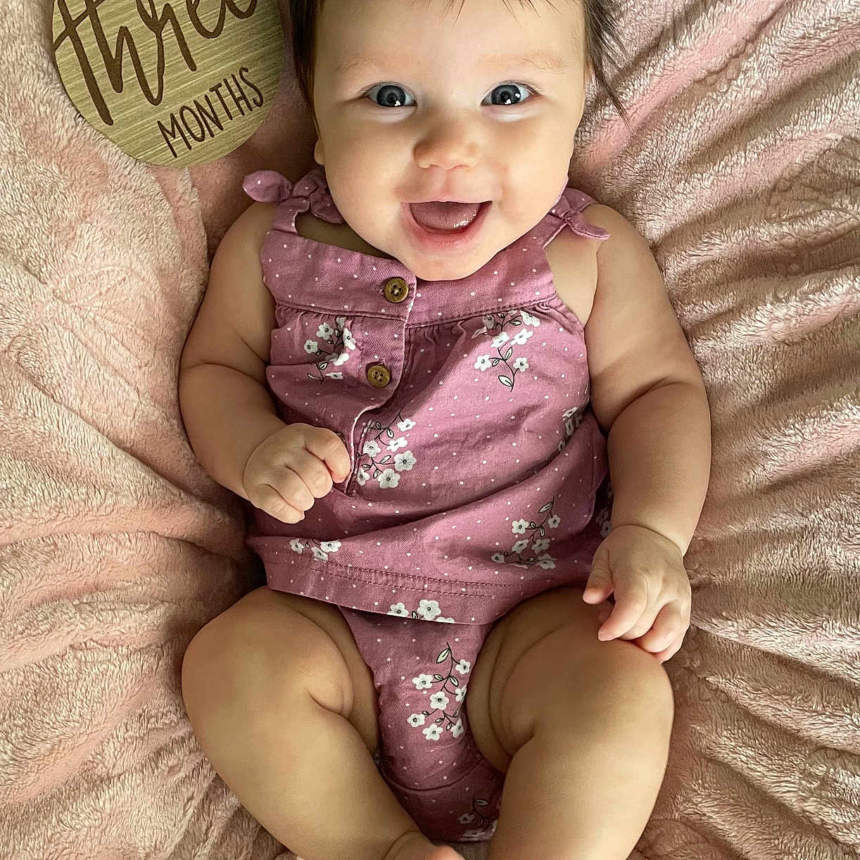 Marley is registered to the contest to win money with this photo: baby, babylaughing, bodypart, clothing, cushion, dress, face, furniture, happy, head, homedecor, laughing, mouth, newborn, person, photography, portrait, quilt, sitting, smile