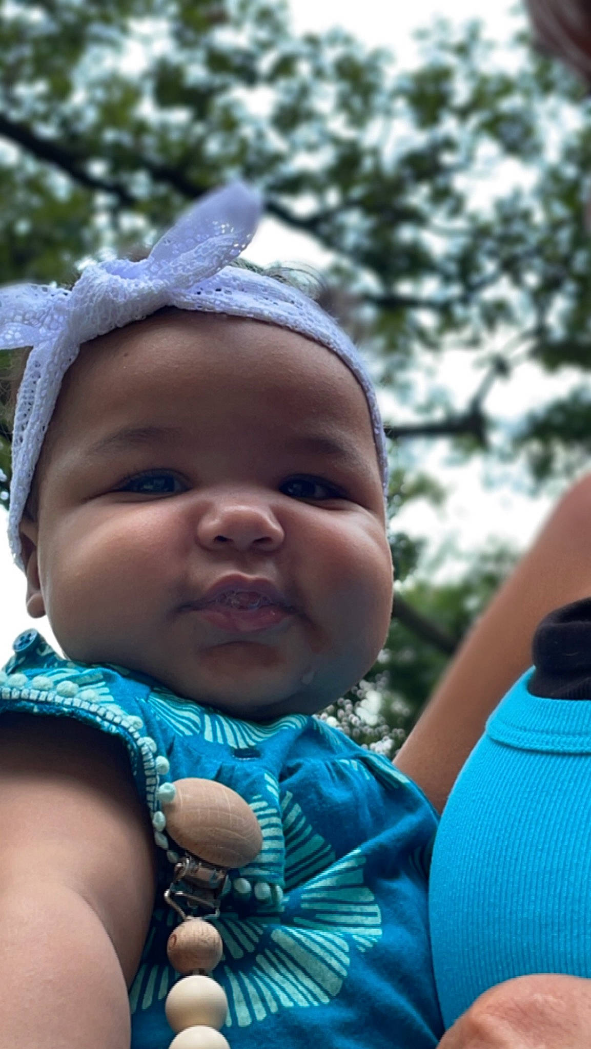 Miya is registered to the contest to win money with this photo: azure, baby, baby_toddler_clothing, blue, child, electric_blue, fashion_accessory, fun, grass, happy, jewellery, leisure, people_in_nature, person, portrait_photography, recreation, skin, sky, toddler, tree