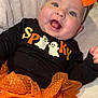 Lilianne joined the competition — help win amazing prizes! baby, child, smiling, halloween, orange_bow, orange_skirt, black_shirt, ghost_graphic, happy, cute, infant, portrait, costume, soft_blanket, indoor, cheerful, festive, clothing, headband, toddler