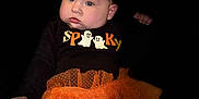 Lilianne joined the competition — help win amazing prizes! baby, child, halloween, costume, orange_bow, tutu, black_background, cute, festive, pumpkin_face, ghost_graphic, long_sleeve_shirt, leggings, portrait, indoor, chubby_cheeks, headband, holiday, smiling, infant