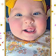 Lilianne joined the competition — help win amazing prizes! baby, child, face, headband, yellow_bow, blue_eyes, smile, tongue, teeth, floral_clothing, cheeks, closeup, portrait, cute, infant, pink_cheeks, confetti, frame, happy, indoors