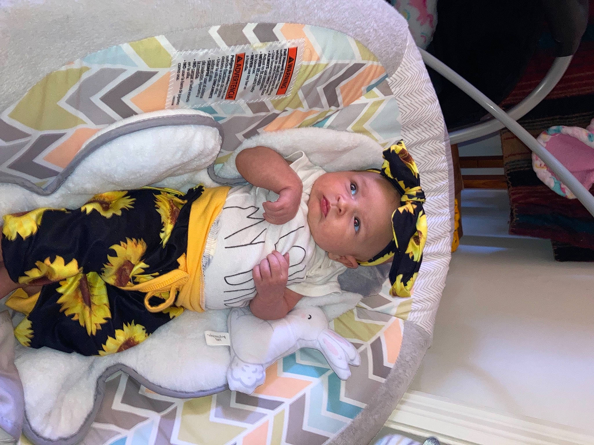 Macey is registered to the contest to win money with this photo: baby, baby_products, baby_safety, baby_toddler_clothing, child, comfort, fictional_character, headwear, linens, pattern, person, product, room, sleeve, t_shirt, textile, toddler