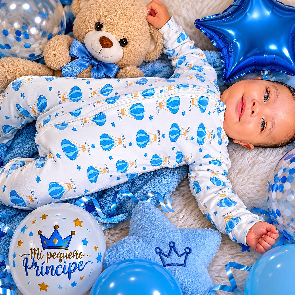 Noah Sotolongo is registered to the contest to win money with this photo: baby, boy, onesie, teddy_bear, balloons, blue, star_shaped_balloon, blanket, plush_toy, happy, smiling, face, infant, celebration, decorations, cute, lying_down, portrait, child, soft_toys