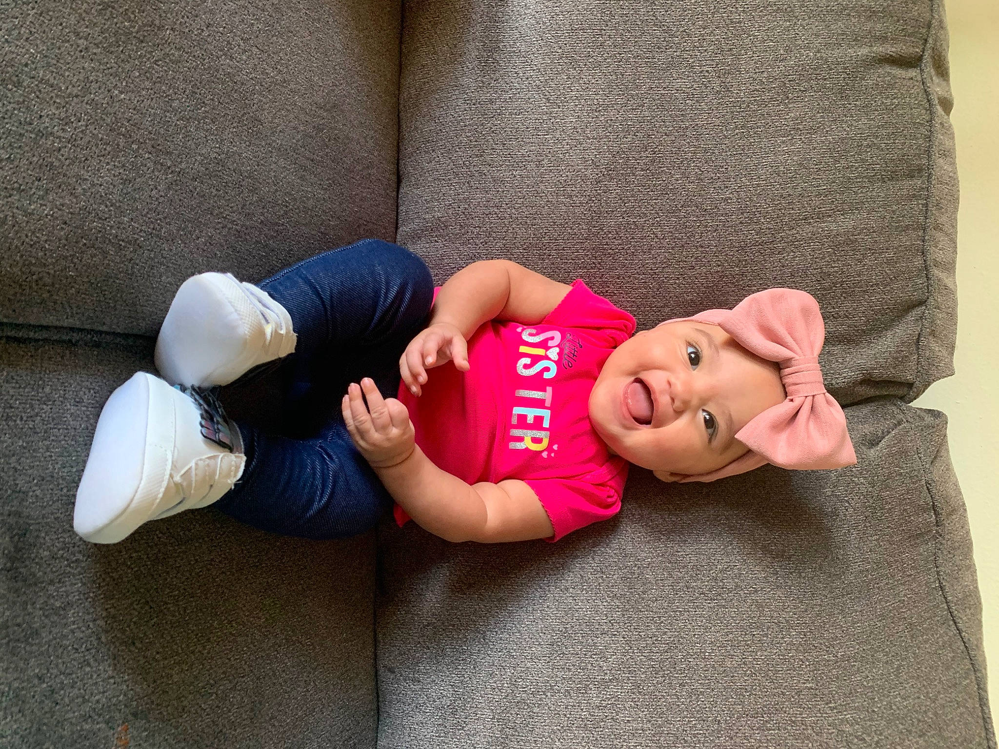 Zariyah is registered to the contest to win money with this photo: abdomen, arm, baby, child, finger, hand, headwear, hip, human_body, human_leg, joint, knee, leg, muscle, nap, neck, person, physical_fitness, pink, sportswear
