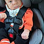 Paxton joined the competition — help win amazing prizes! baby, black_pants, car_interior, car_seat, child, closeup, cute, expression, face, halloween_theme, head, indoors, infant, knitted_booties, orange_clothing, portrait, pumpkin_design, safety, seatbelt, small_hands