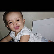 Jana joined the competition — help win amazing prizes! baby, child, smiling, crawling, white_clothing, earring, indoor, wall, furniture, happy, face, portrait, skin, head, person, toddler, cute, infant, young_child, expression