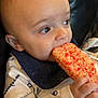 Asher is registered to the contest to win money with this photo: baby, infant, child, food, snack, hand, face, eyes, clothing, bib, leather, seat, closeup, portrait, indoor, cute, curious, sprinkles, colorful, holding