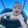 baby, child, swing, smiling, outdoor, blue_sky, chains, playground, happy, infant, face, person, clothing, seat, daylight, cute, joy, fun, young, portrait