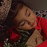bouquet, child, clothing, cozy, cute, face, flower, greenery, hand, hugging, indoor, peaceful, portrait, red, resting, rose, sleeping, tiara, warm, young
