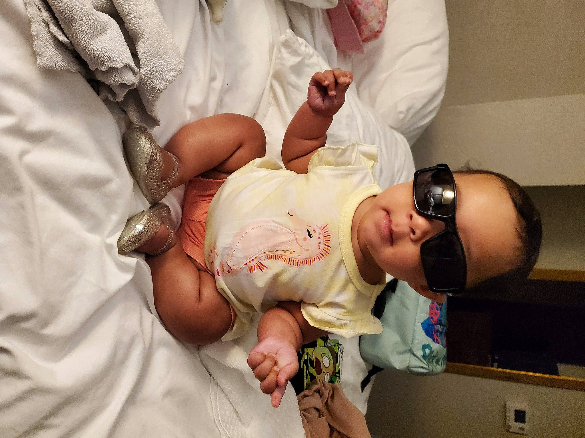 Inaya is registered to the contest to win money with this photo: abdomen, arm, baby, child, event, finger, gesture, hand, happy, health_care, human_body, joint, medical, medical_procedure, patient, person, room, service, skin, thumb